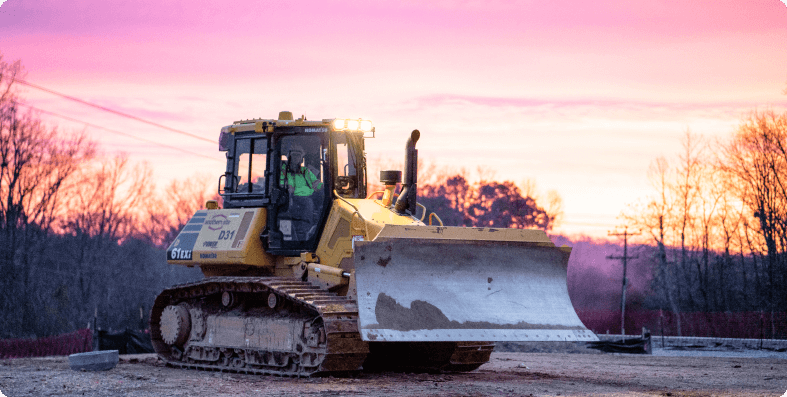 Bulldozer at sunrise